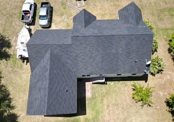 Aerial view of a house roof after roof rejuvenation treatment